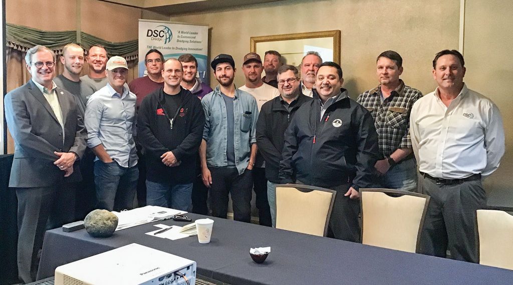 Participants of DSC Dredge’s 2020 “Dreducation Class” gather for a photo. Pictured from DSC Dredge are Charles Johnson (left), director of sales for DSC Dredge, and William Wetta (right), DSC’s senior vice president and chief technology officer.