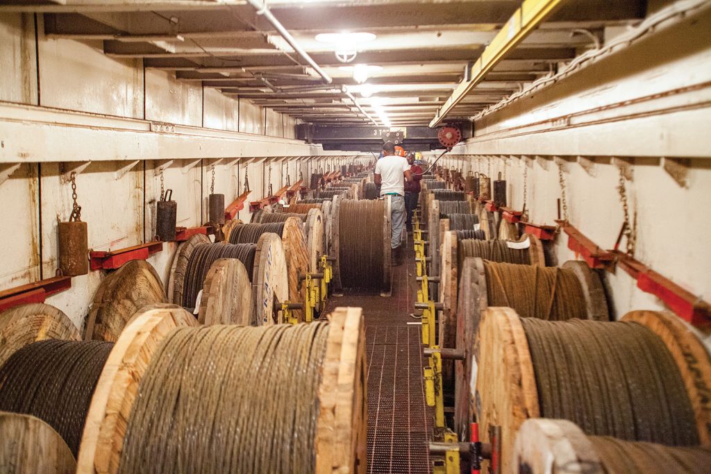 Below deck on the mat laying barge, the Corps' revetment team stores all the cables used to lower the concrete mattress to the riverbed. The cables are fed through the "Figure 8 Room," which amounts to a complex braking system that keeps the powerful Mississippi River current from pulling the mat out too fast. (Photo by Frank McCormack)