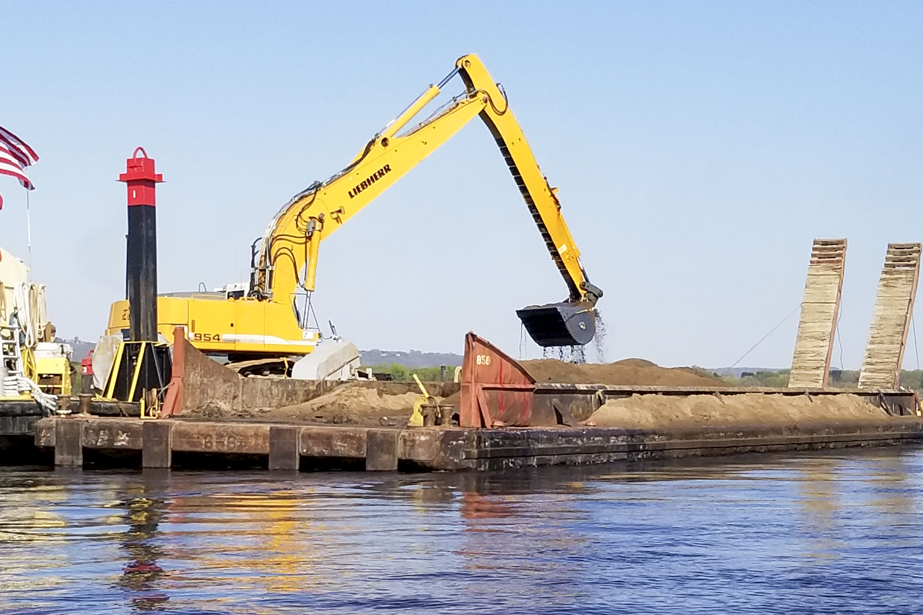 The Corps' mechanical dredge Wade working in the navigation channel (Photo courtesy of St. Paul Engineer District)