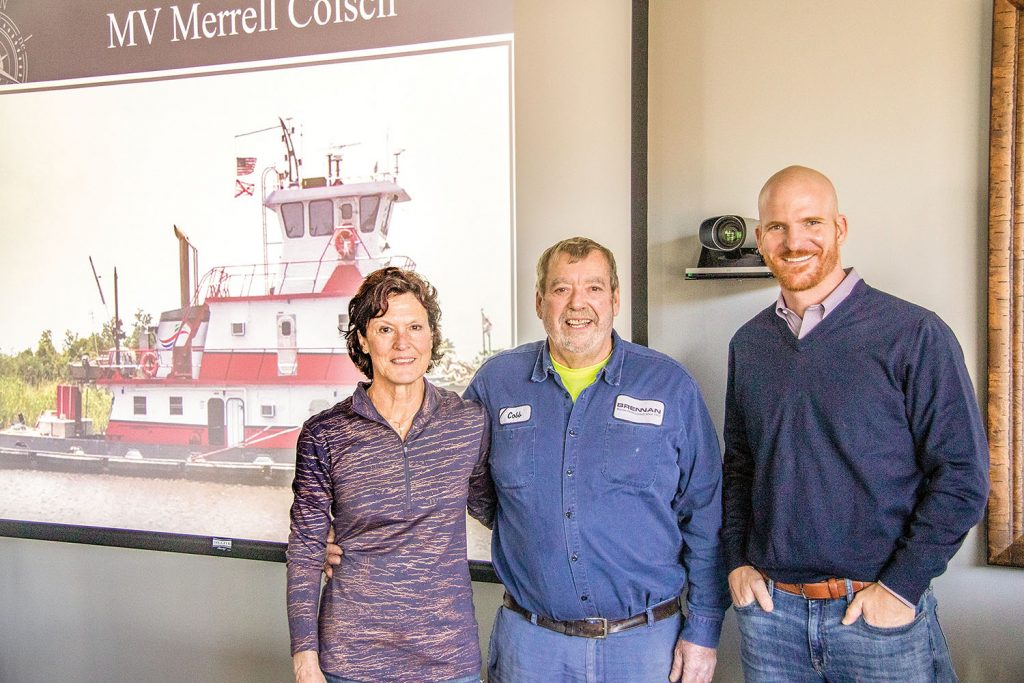 The vessel’s namesake, Merrell Colsch (center), with his wife Karen and Adam Binsfeld, president of J.F Brennan Company Inc.