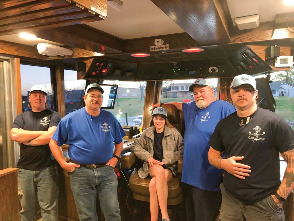 Anna Frances Devall with the crew of her namesake vessel in the pilothouse.