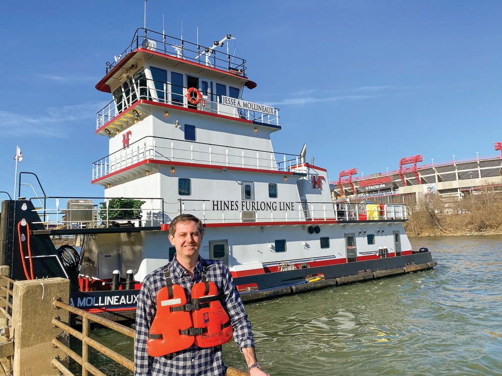 Jesse Mollineaux stands in front of his namesake vessel.