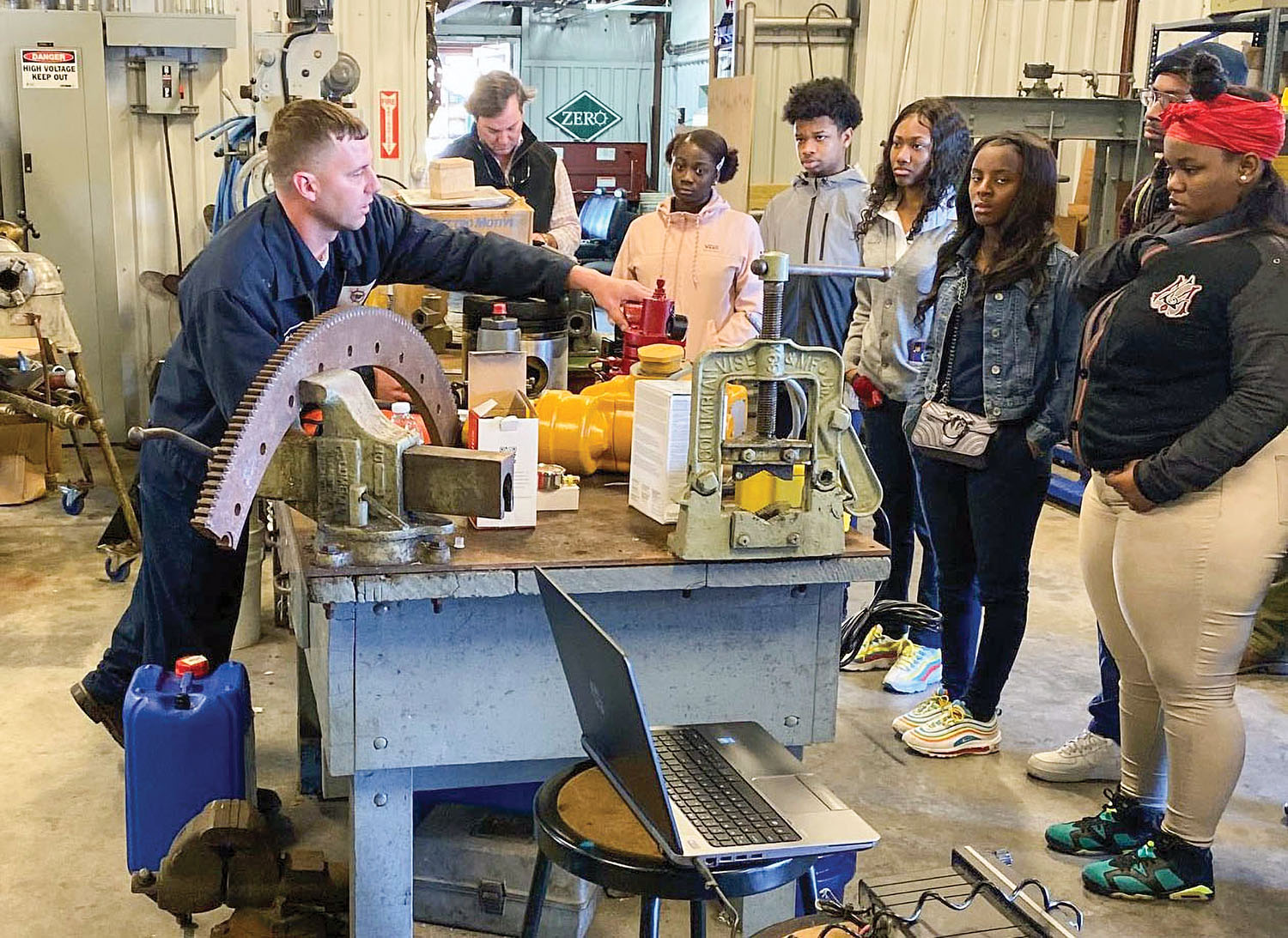 Brian Karl (left), mechanic for Crescent Towing in New Orleans, speaks to high school students touring the company’s west bank headquarters during a recent Who Works the Rivers event. Andrew Cooper, executive vice president of Crescent Towing, served as tour guide for the students. (Photo courtesy of Crescent Towing)