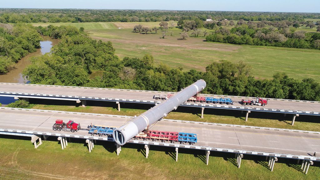 Following the barge move, the column vessel had to span both directions of the highway crossing the San Bernard River because of bridge weight restrictions. (Photo courtesy of Barnhart Crane & Rigging)