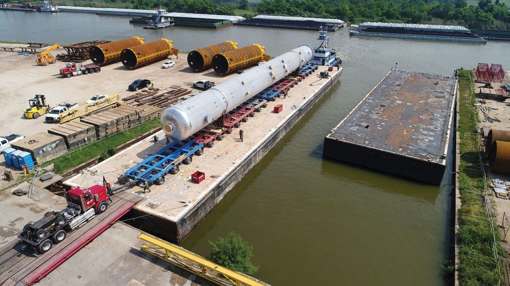 317-foot-long, 800,000-pound depropanizer column vessel moved by barge from Houston to Freeport, Texas. (Photo courtesy of Barnhart Crane & Rigging)