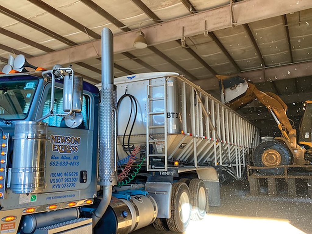 A Newsom truck is being loaded inside the warehouse. (Photo courtesy of Jim Newsom Ag Service)