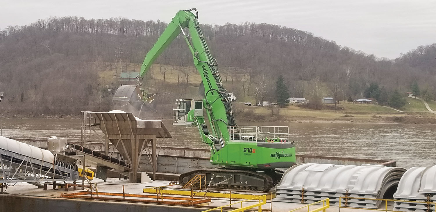 The hydraulic cab of the new machine can move forward and back to allow a better view into the barge hold. (Photo courtesy of Sennebogen)