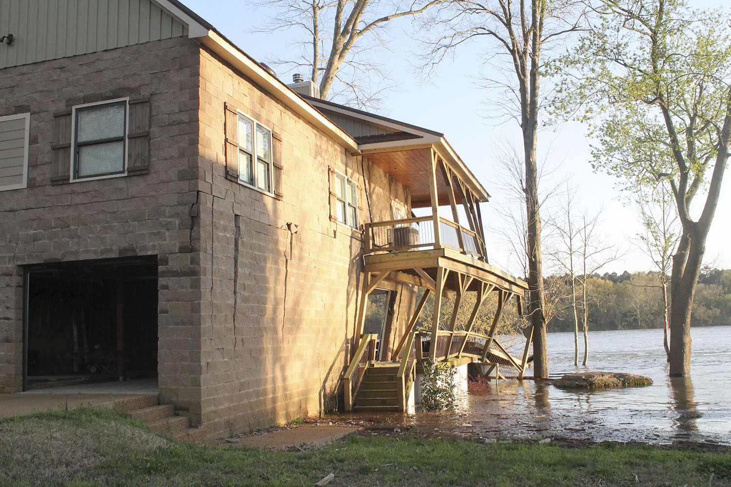 The U.S. Coast Guard said a house on Arnold Drive in Savannah, Tenn., received significant damage after 14 empty barges broke away from the mv. Roger L. Knight, which had been chartered by Inland Marine Service. (Photo by R. Kelly Jordan, The Courier)