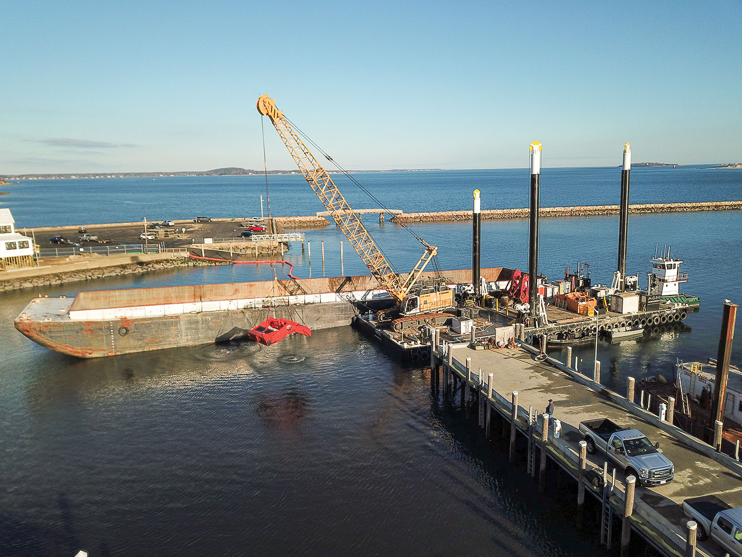 The AGM Marine Contractors dredge Triton with Liebherr crane and 9-cubic-yard Cable Arm Environmental bucket.