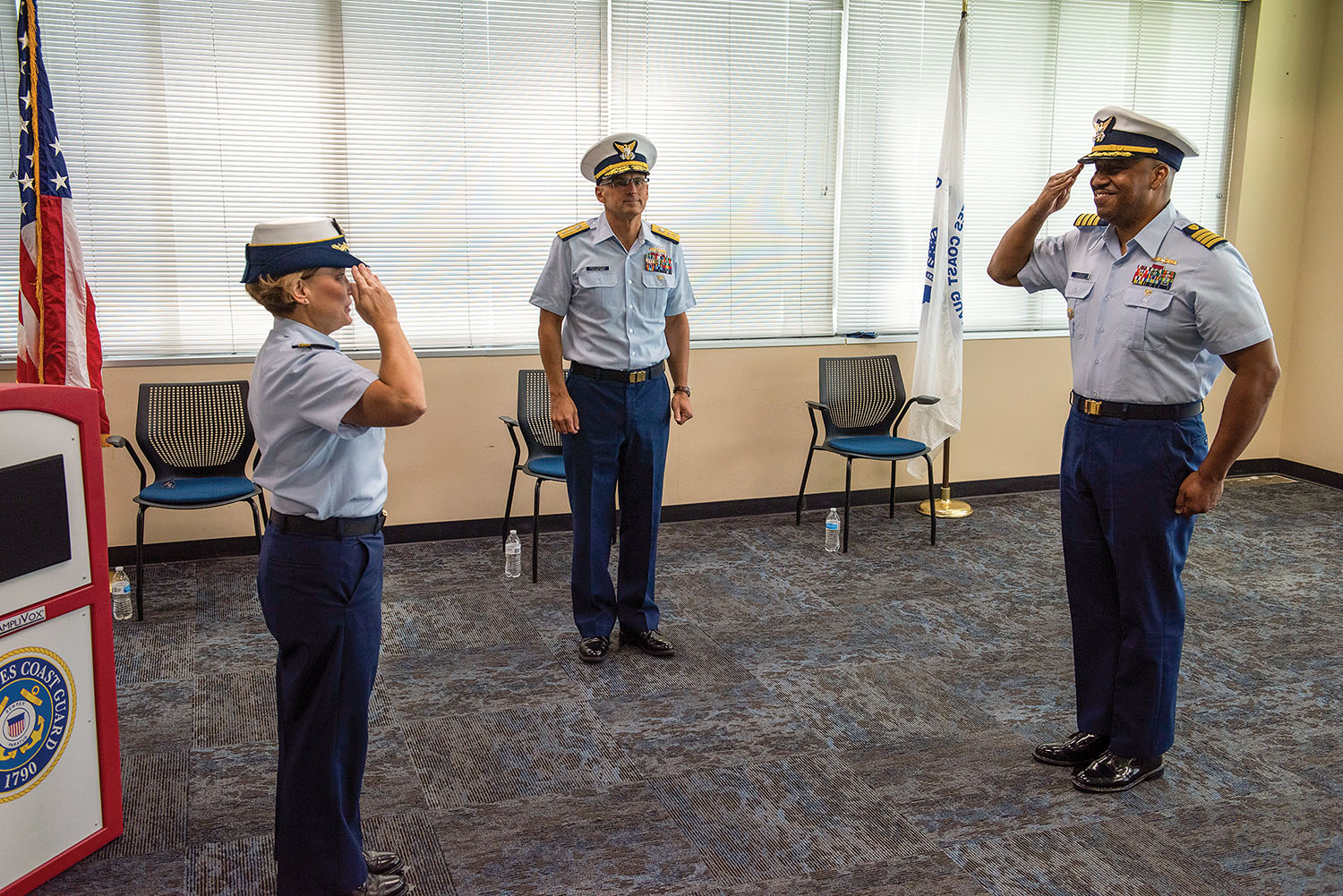 From left, Cmdr. Richard M. Scott, Capt. Scott A. Stoermer and Senior Chief Petty Officer Scott A. Manfre, command senior chief, Sector Upper Mississippi, are shown at the sector’s May 27 change of command ceremony, during which Stoermer passed command to Scott. (U.S. Coast Guard photo by Petty Officer 2nd Class Monika Spies)