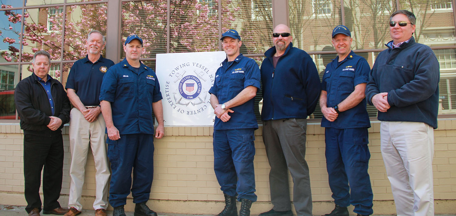 The Towing Vessel National Center of Expertise team stands in front of the office in Paducah, Ky. From left are Jim Van Wormer, Mike Kelly, Lt. Cmdr. Chuck Mellor, Cmdr. Andrew Bender, Dave Phillips, Chief Warrant Officer Mark Belt and Steve Douglass. (Courtesy of the Towing Vessel National Center of Expertise)