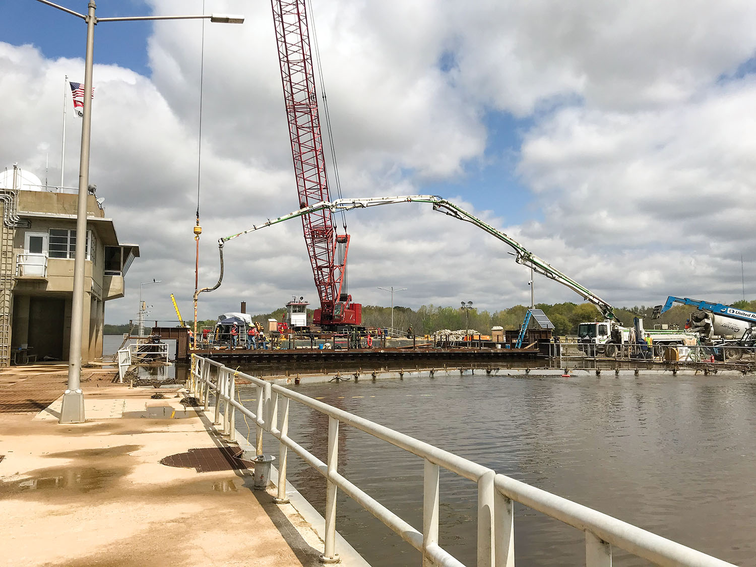 Larger-than-expected voids meant Massman had to bring in an additional floating crane and use tremie concrete and pressure grouting. (Photo courtesy of Massman Construction)