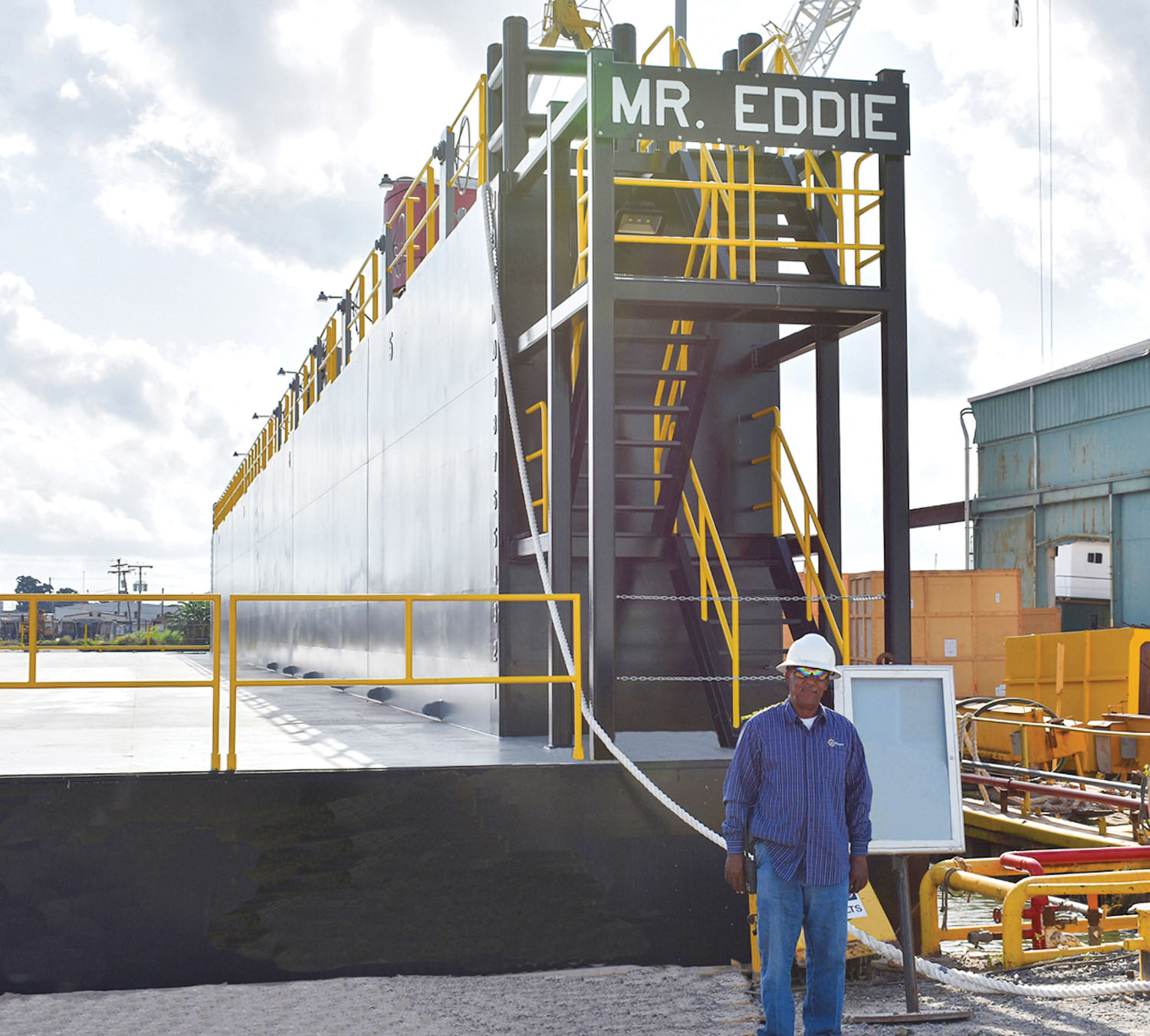 Eddie Barnes stands in front of his namesake drydock, the Mr. Eddie, which was built for Bollinger Quick Repair by Bollinger Shipyards’ Amelia, La., yard. (Photo courtesy of Bollinger Shipyards)