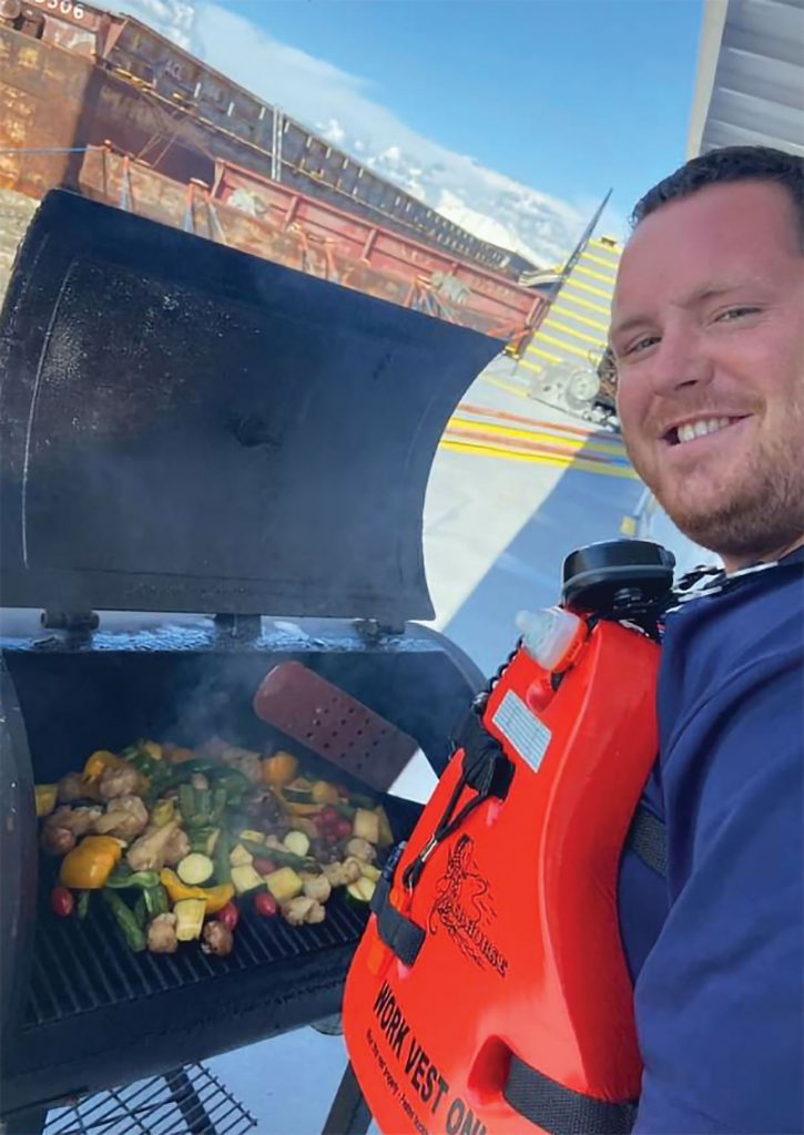 Brandon Branning grills a vegetable medley.