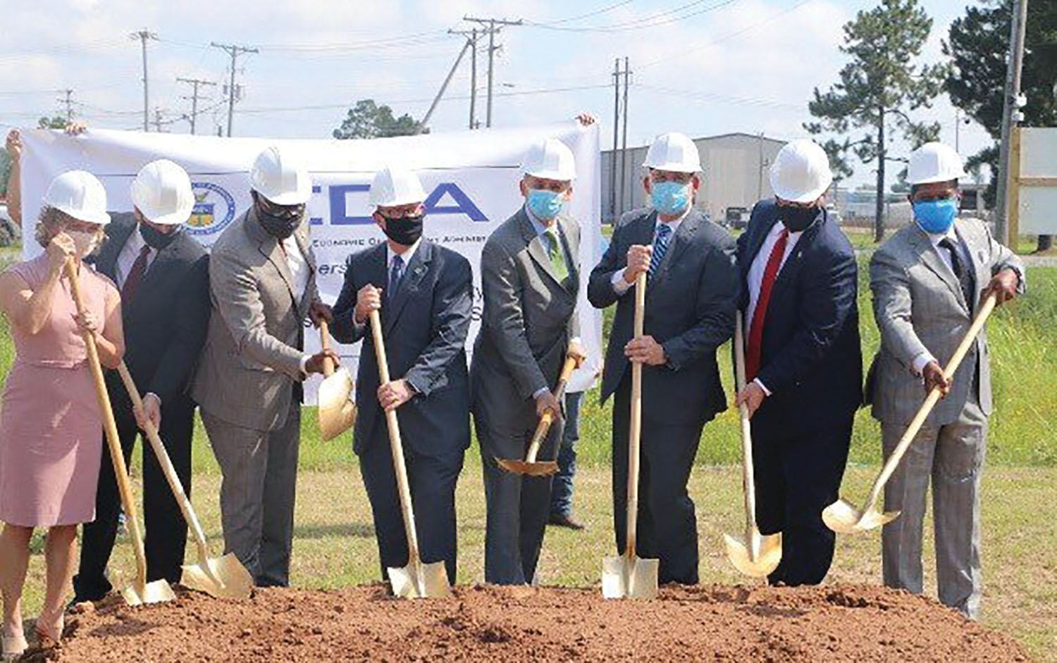 Federal, state and local officials pose for a ceremonial photograph for the July 6 groundbreaking at the Port of Little Rock. (Photo courtesy of the Port of Little Rock Authority)