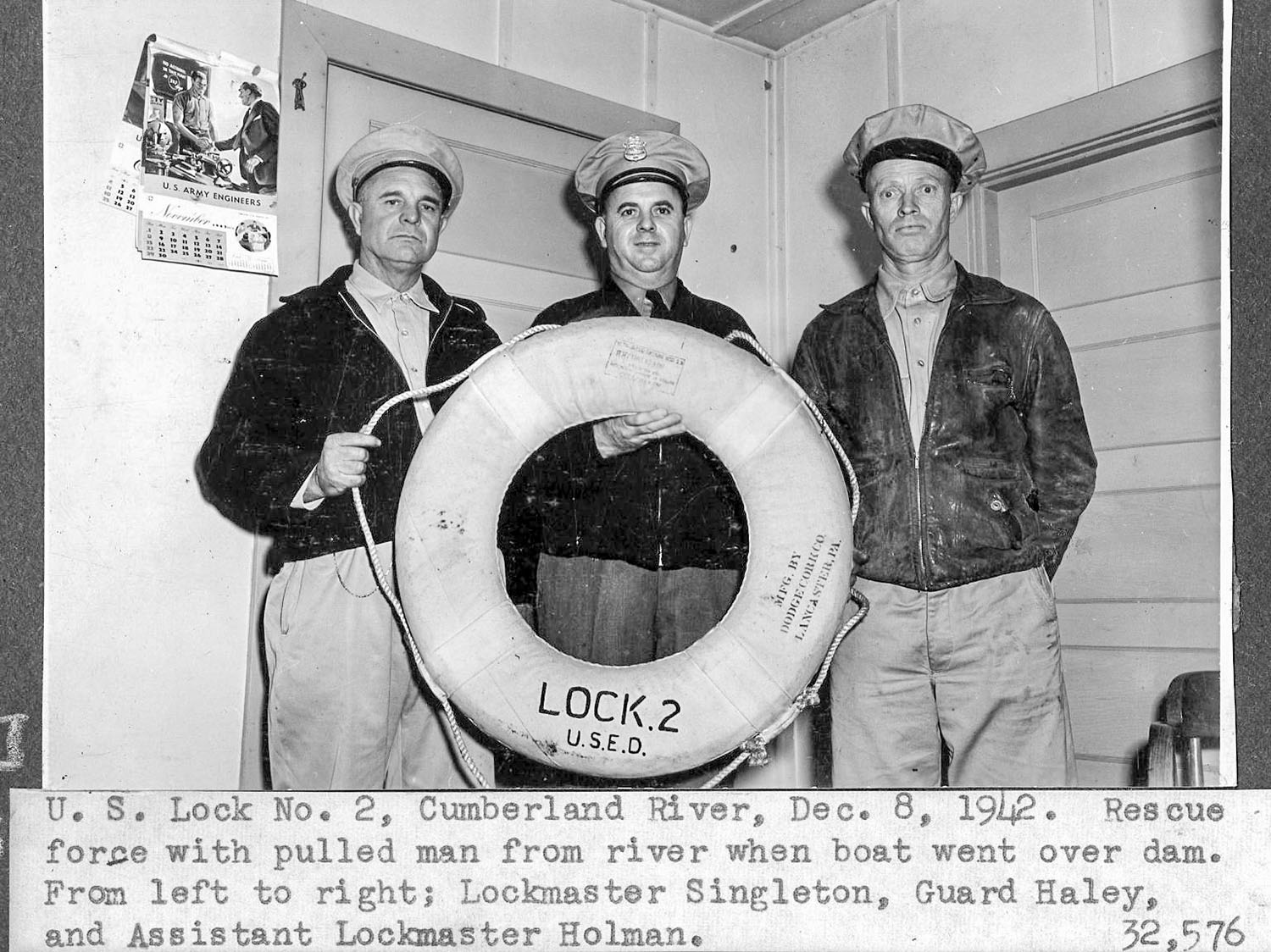 From left, Lockmaster Singleton, Guard Haley and Assistant Lockmaster Red Holman of the Nashville Engineer District pose after rescuing a man when his boat went over Dam 2 on the Cumberland River in Nashville, Tenn., December 8, 1942. (Nashville Engineer District historic photo)