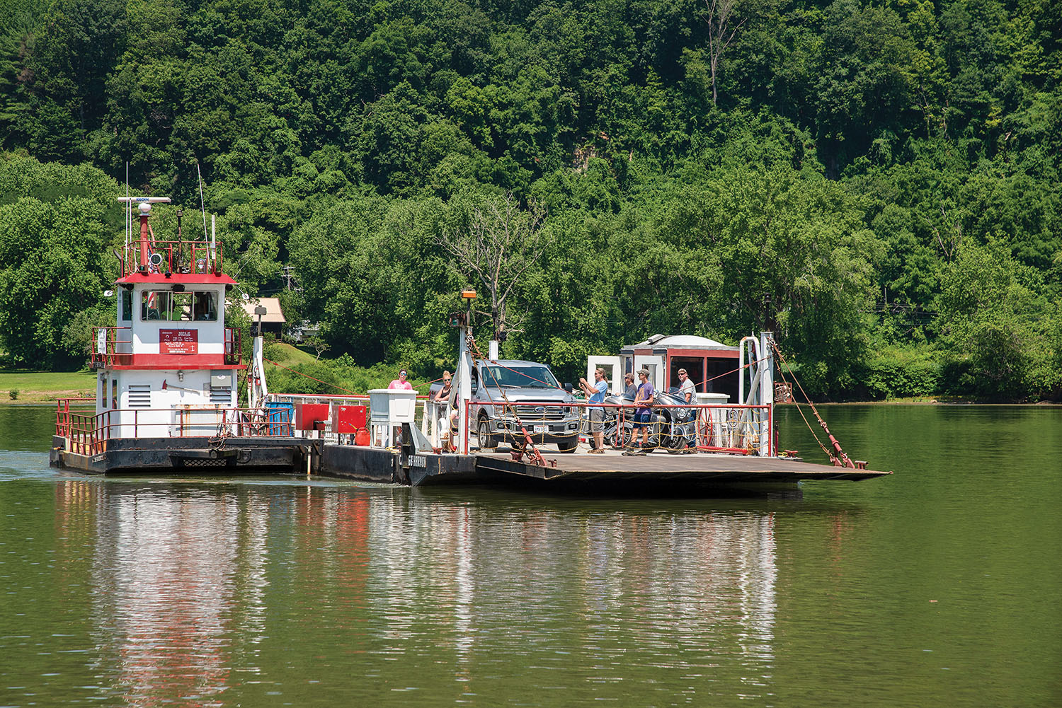 The Sistersville ferry arrives at Sistersville, W.Va., with a load of vehicles from Ohio. (Photo by Jim Ross)