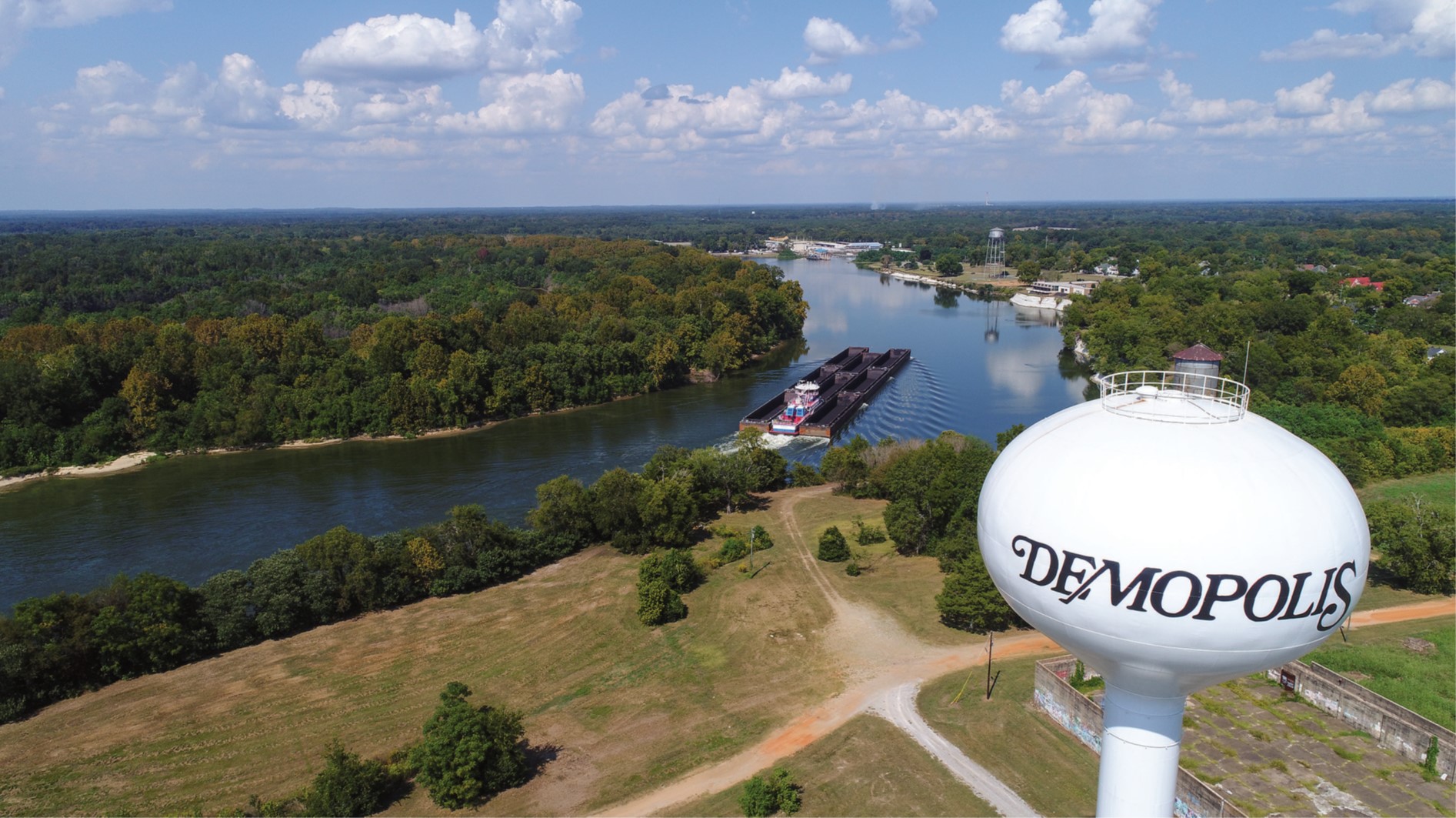 —photo courtey of Parker Towing The mv. Charles Haun, part of Parker Towing Company’s fleet, pushes empty hopper barges through Demopolis, Ala., near the confluence of the Tennessee-Tombigbee Waterway and the Black Warrior-Tombigbee Waterway.