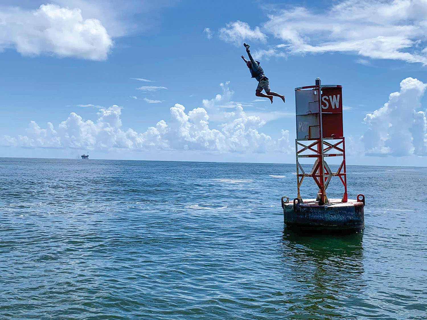 Joey Cargol finished his journey with a leap from the sea buoy that marks the end of the river. (Photo courtesy of Joey Cargol)