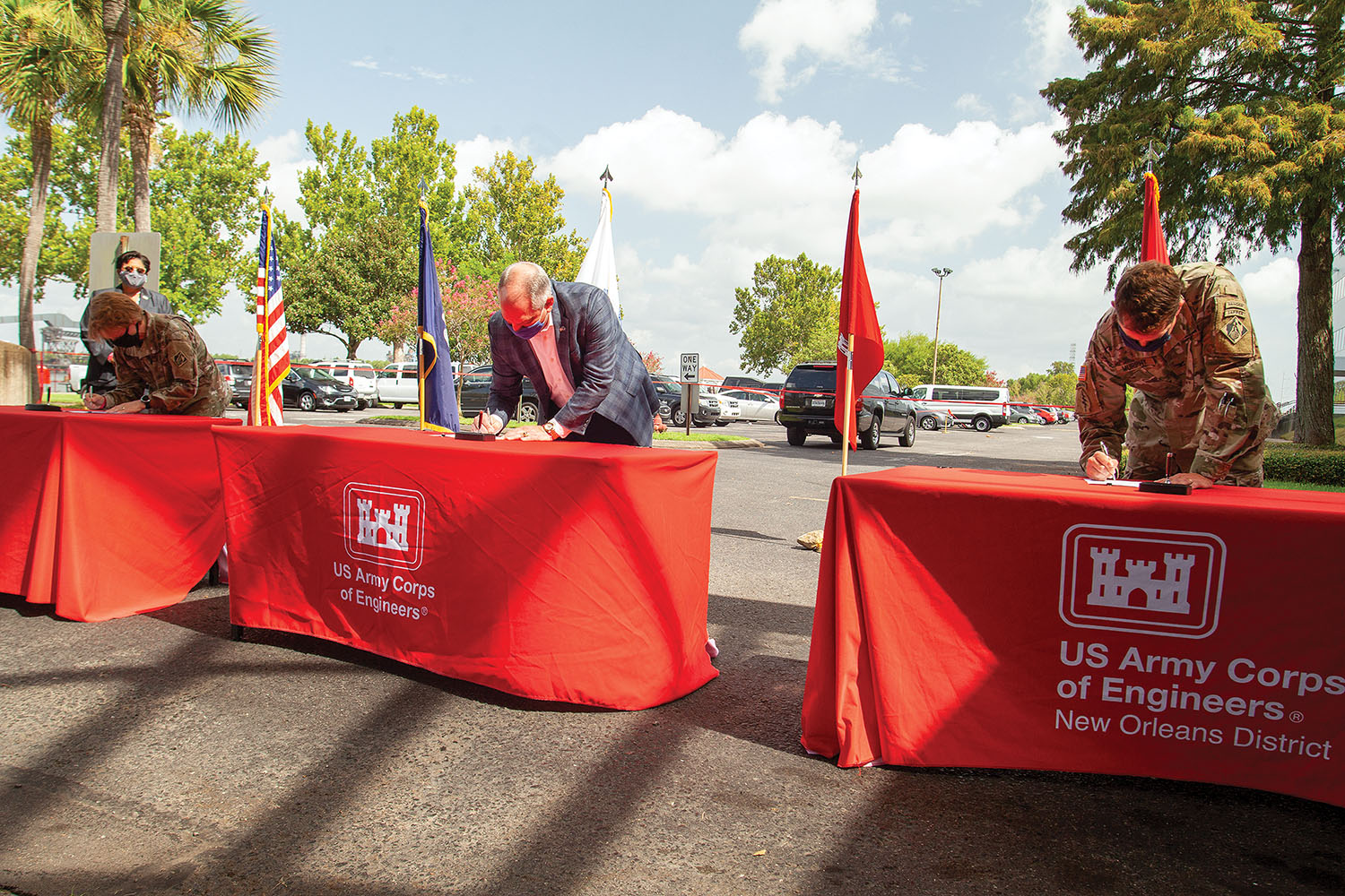 From left, Mississippi Valley Division Engineer Maj. Gen. Dianna Holland, Louisiana Gov. John Bel Edwards, and New Orleans District Engineer Col Stephen Murphy sign project partnership agreement July 31. (Photo by Frank McCormack)