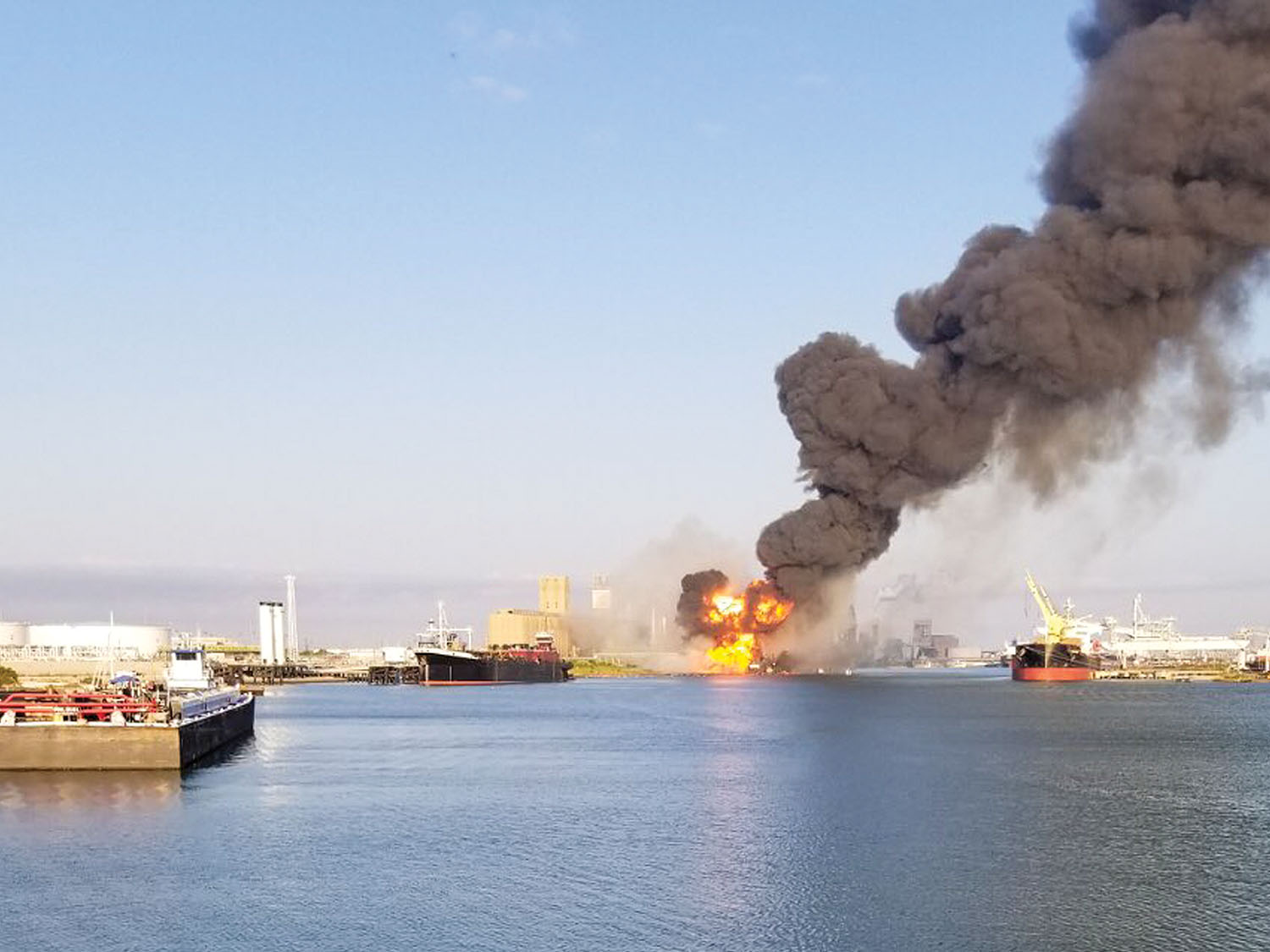 Coast Guard crews respond to a dredge on fire in the Port of Corpus Christi Ship Channel, August 21. A Sector/Air Station Corpus Christi MH-65 Dolphin helicopter crew was launched to the scene, hoisted two injured crewmembers, and transferred them to Corpus Christi Medical Center-Bay Area. (U.S. Coast Guard photo)