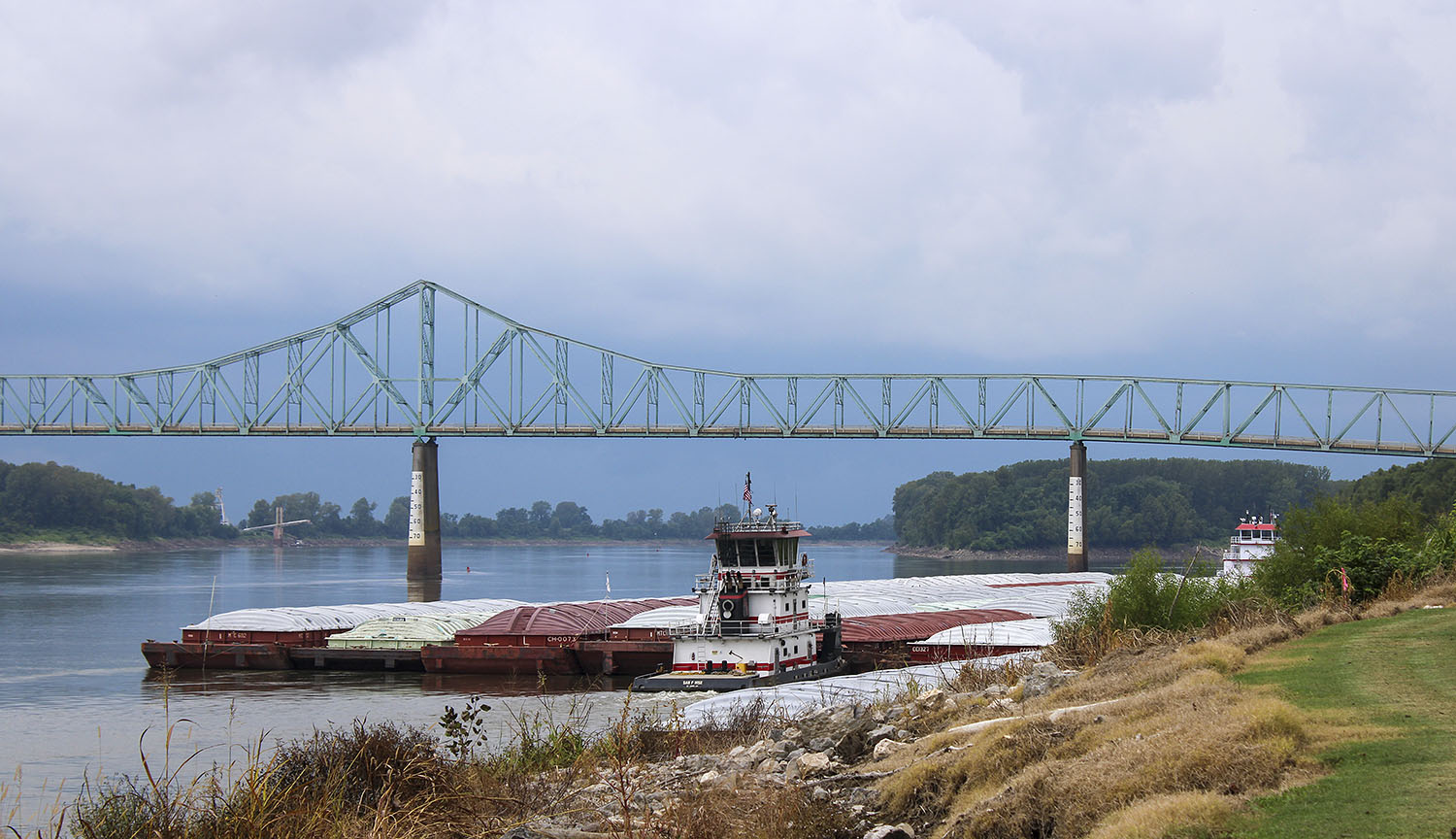 The mv. Sam P. Hise pushes a barge into the Upper Mississippi River on August 31 from near the confluence of the Ohio and Mississippi Rivers as seen from the southern tip of Illinois. Four western Kentucky counties have formed a riverport authority with plans to develop a riverport just south of the confluence. (Photo by Shelley Byrne)