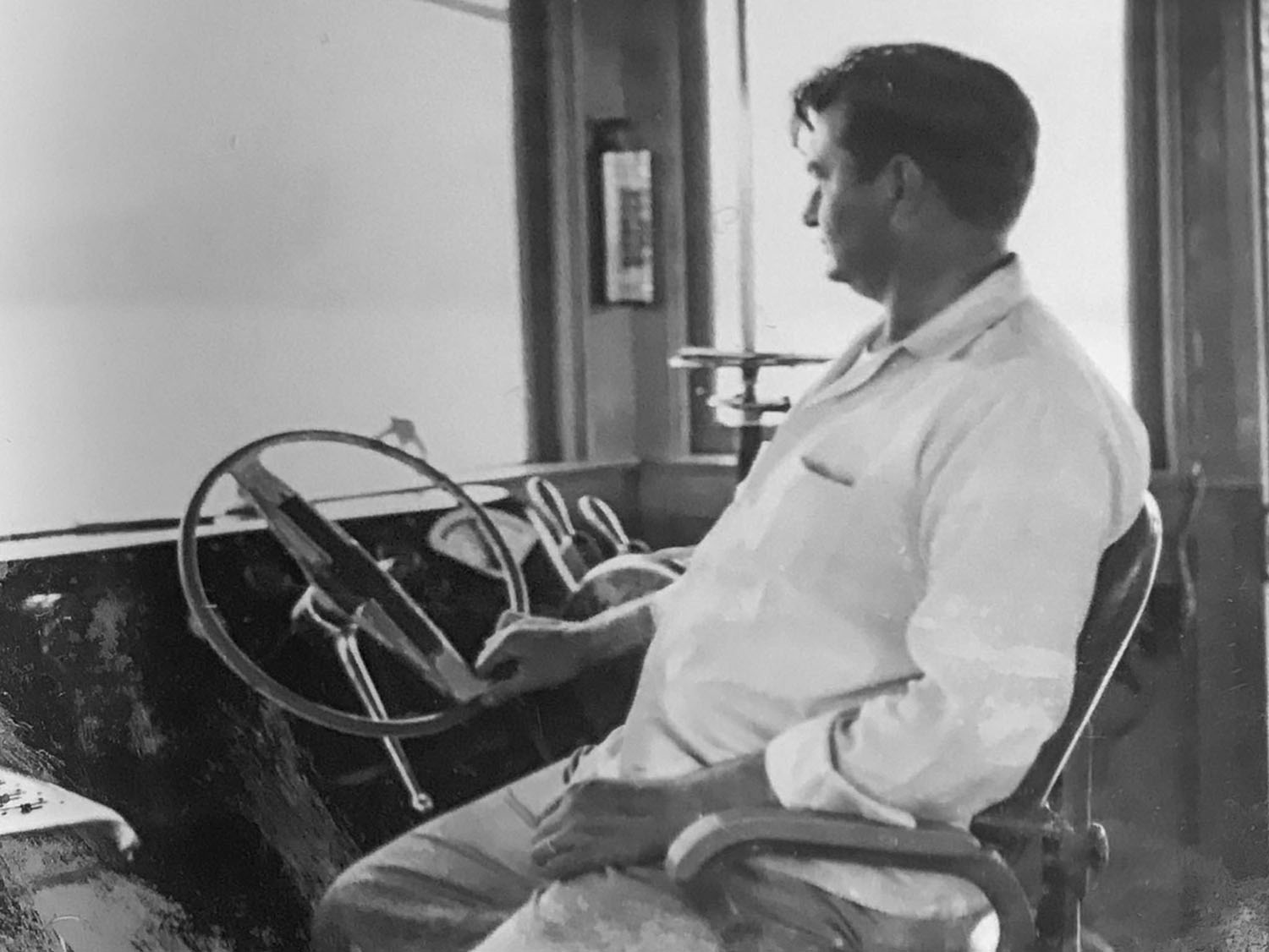 Ancel Burnett in the pilothouse of the Dan C. (Photo courtesy of Bill Burnett)