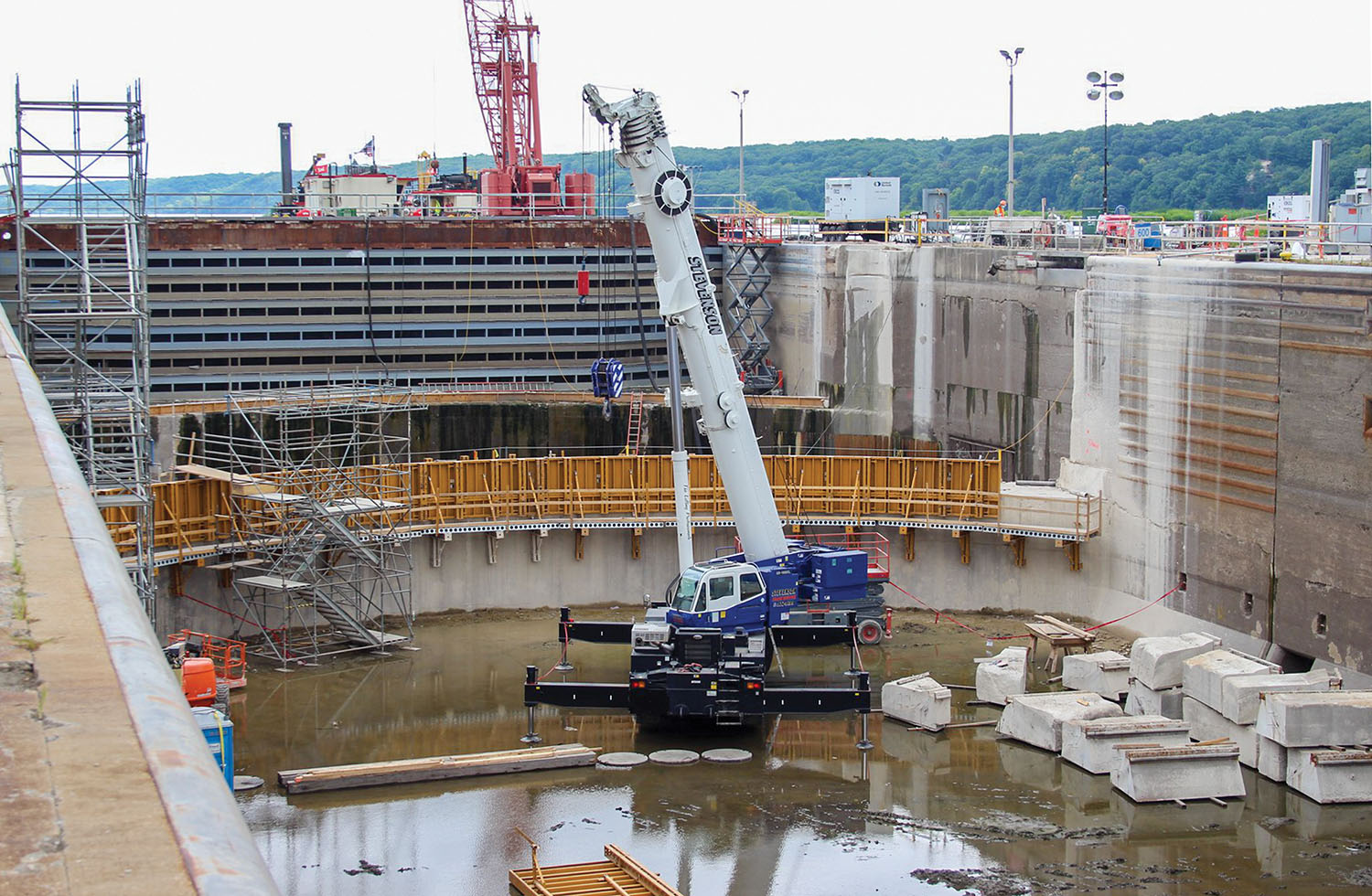 New forms being placed on the upper gate sill at Starved Rock Lock and Dam; the blocks from the old upper sill that were cut and removed are shown. (Photo courtesy of the Rock Island Engineer District)