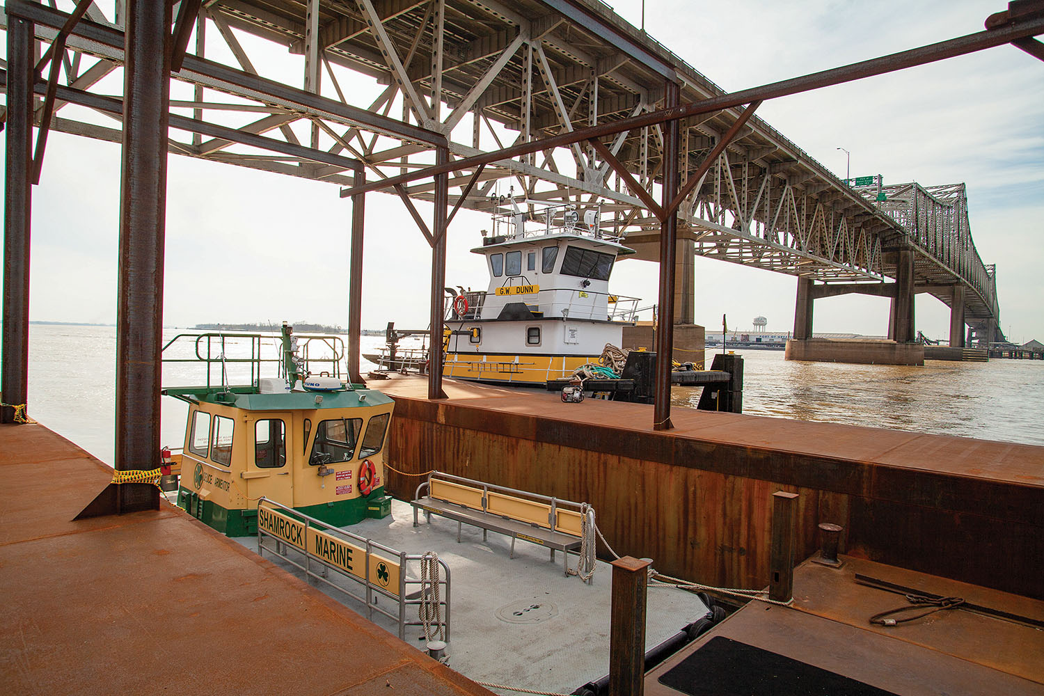 Shamrock Marine’s crew boat Deuce Armentor and M&P Barge Company’s G.W. Dunn are moored at Shamrock’s new sprawling dock on the left descending bank in Baton Rouge, La. (Photo by Frank McCormack)