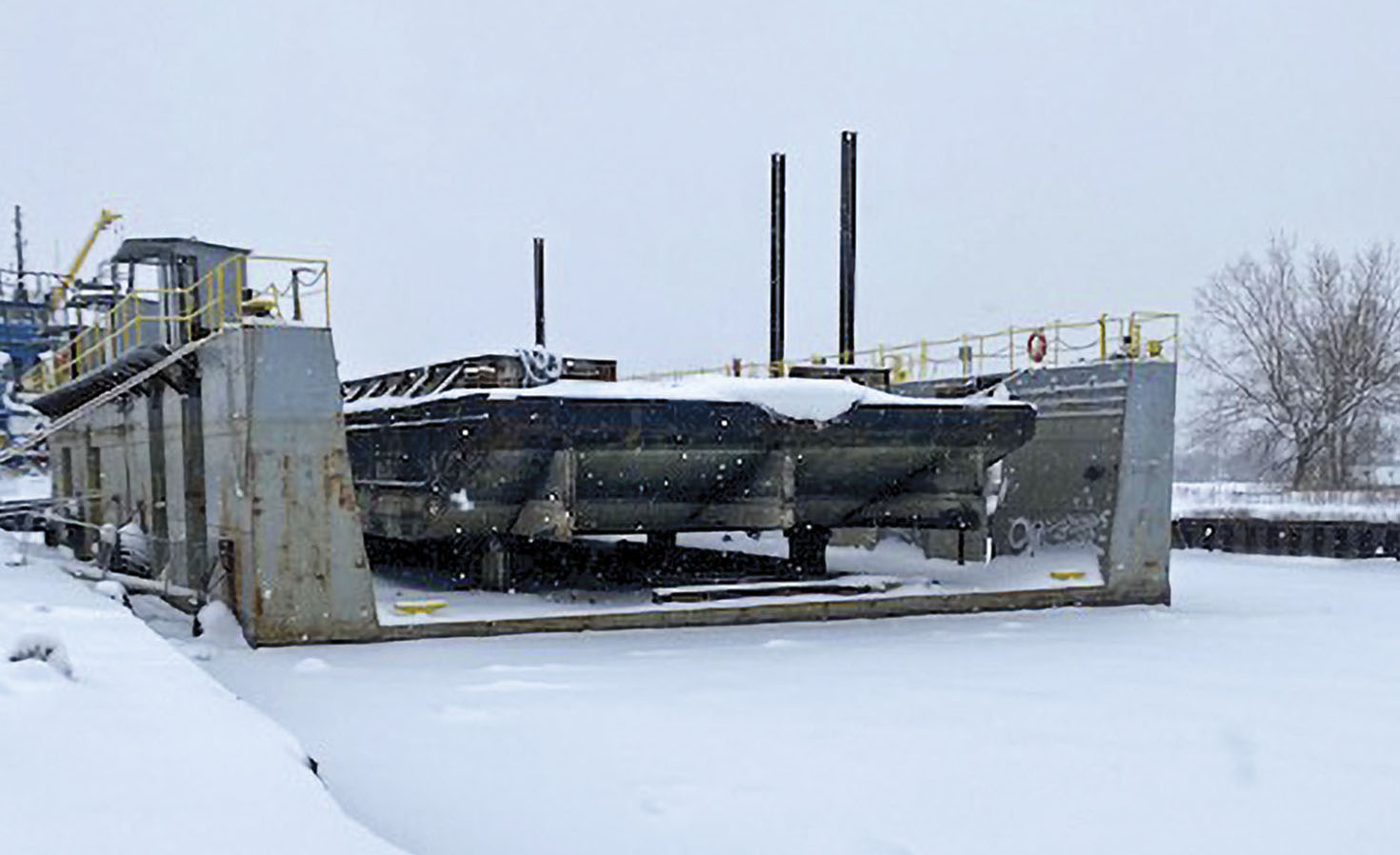 A deck barge awaits repairs in a drydock Calumet River Fleeting is leasing in Chicago. Calumet is leasing the PTG Chicago Dry Dock facility with plans to purchase it in early 2022. (Photo courtesy of Calumet River Fleeting)