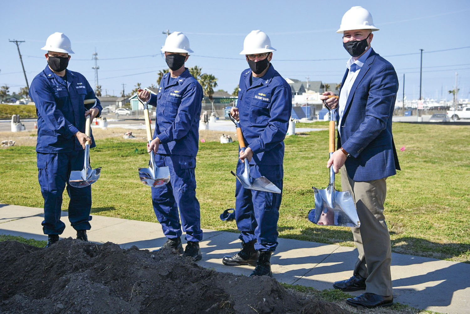 From left, Master Chief Petty Officer Jeffery Scully, officer-in-charge of Station Port Aransas; Capt. Edward Gaynor, commander of Coast Guard Sector/Air Station Corpus Christi; Rear Adm. John P. Nadeau, commander of Coast Guard Eighth District; and Aaron Glover, vice president at the Whiting-Turner Contracting Company, offically break ground for the new construction at Station Port Aransas during a ceremony at Coast Guard Station Port Aransas, Texas, February 22. The previous buildings at the station were heavily damaged during Hurricane Harvey in 2017. (Photo by U.S. Coast Guard Petty Officer 2nd Class Ryan Dickinson)