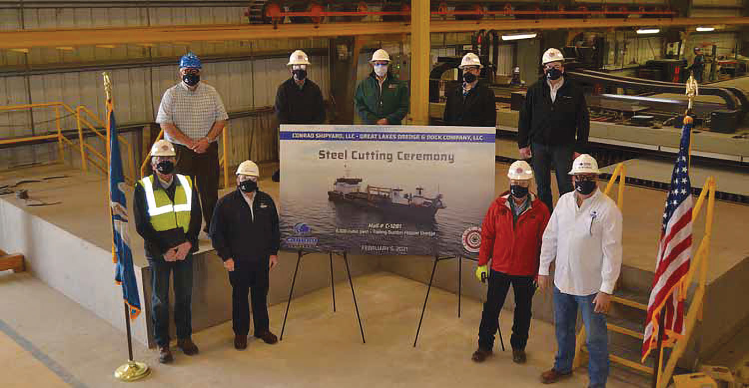 Taking part in Conrad Shipyard’s steel-cutting ceremony for the new 6,500-cubic-yard hopper dredge for Great Lakes Dredge & Dock are, bottom row from left: Vidar Lindmoen, GLDD new build program director; Dan Conrad, Conrad senior vice president; David Simonelli, GLDD chief operating officer; and Dave Mercer, Conrad senior project manager. Top row, from left: Brett Wolbrink, Conrad chief operating officer; Dan Gaiennie, GLDD director of engineering; Brian Barton, GLDD site supervisor; Bobby Gomez, GLDD electrical systems manager; Chris Roberts, GLDD vice president.