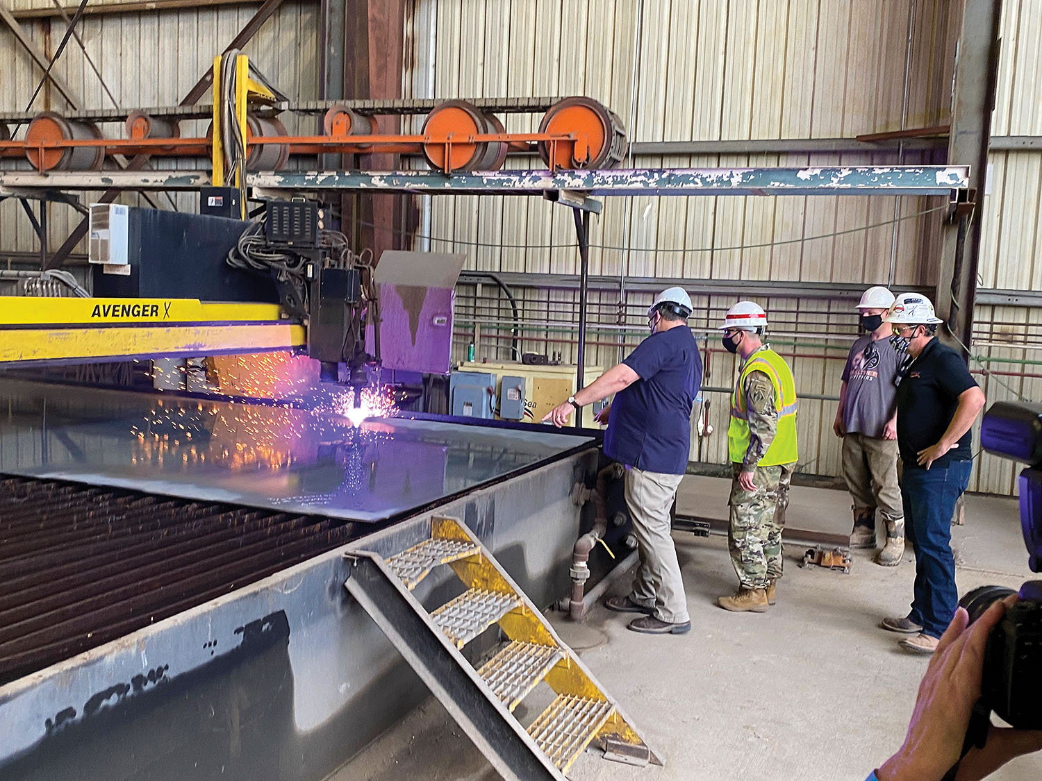 Col. Robert Hilliard, Vicksburg District commander, watches steel-cutting for ARMOR 1, the next-generation mat-sinking unit, at Thoma-Sea Shipyard.(Photo courtesy of Corps of Engineers)