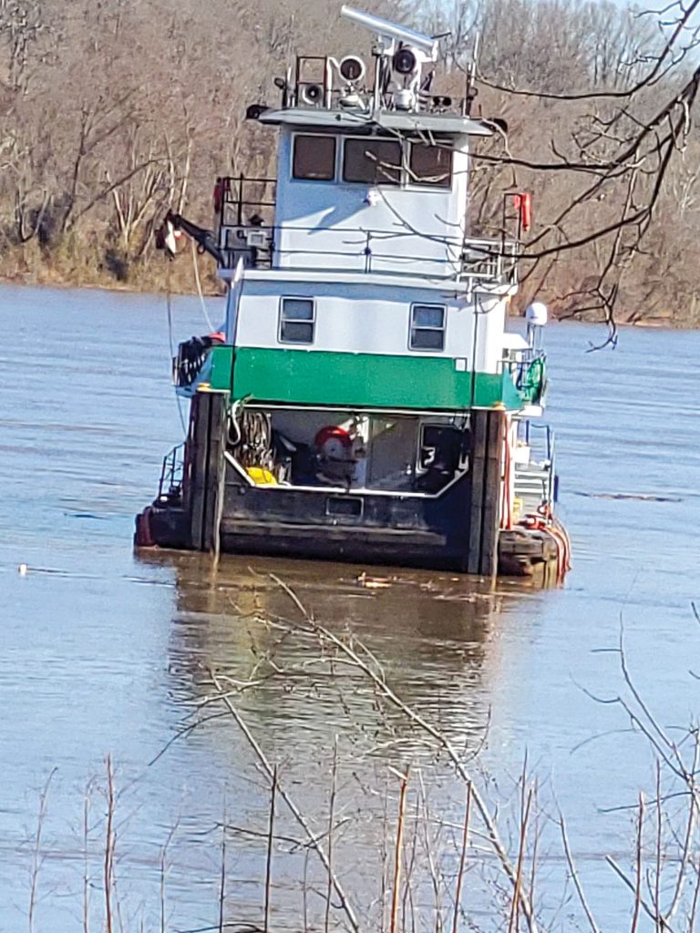 The mv. Edith Tripp free floats down the Ohio River below the Belleville Locks and Dam on March 3. The crew was able to escape in two skiffs before the boat and an empty gravel barge both went through the dam’s gates. (Photo courtesy of Meigs County (Ohio) Emergency Management Director Jamie Jones)