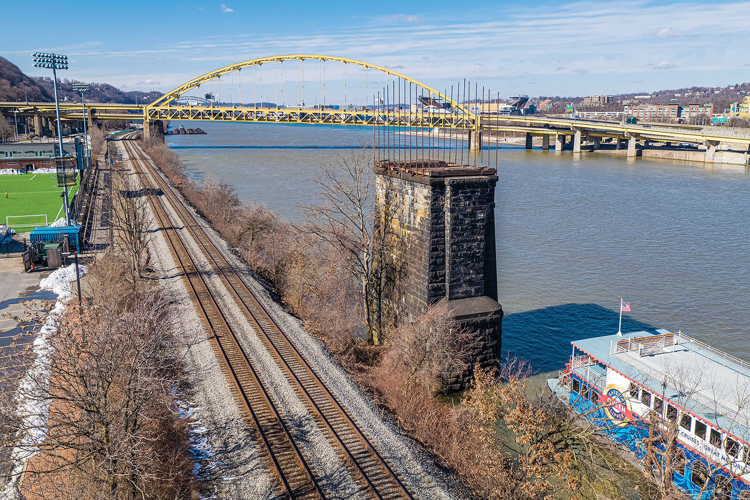 Today, all that is left of the Wabash Bridge are two 90-foot stone piers topped with flagpoles. They are sunk along both the northern and southern shores of the Monongahela River. (Photo courtesy of Hanna Langholz Wilson Ellis)