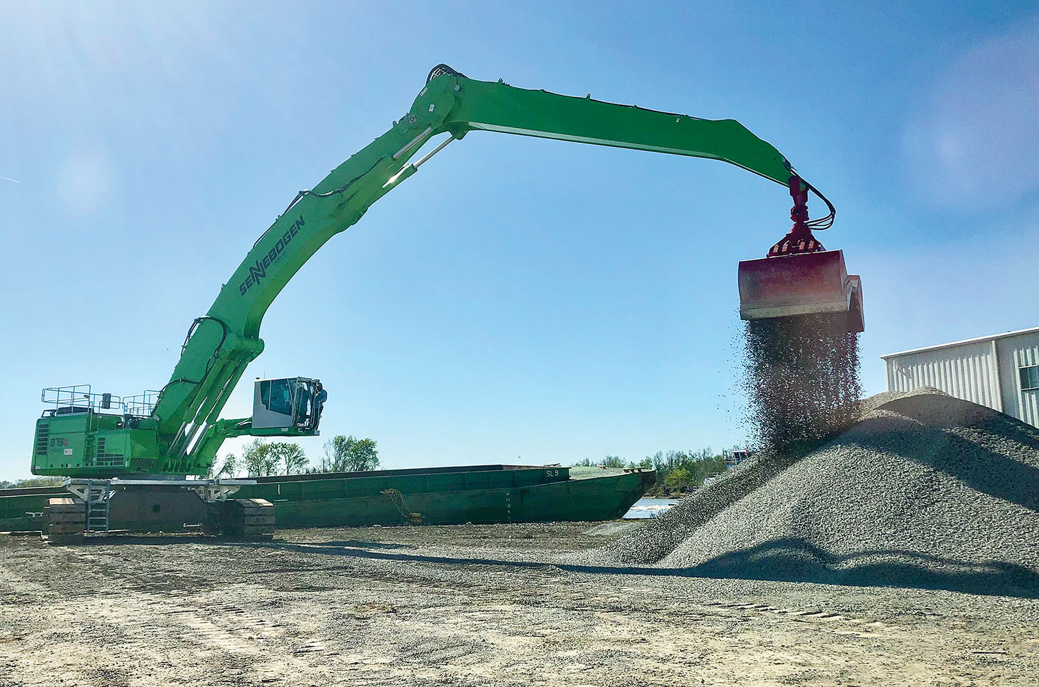 With the cab in position, the operator of a Sennebogen 875 has a perfect view of the barge and the pile. (Photo courtesy of Sennebogen)