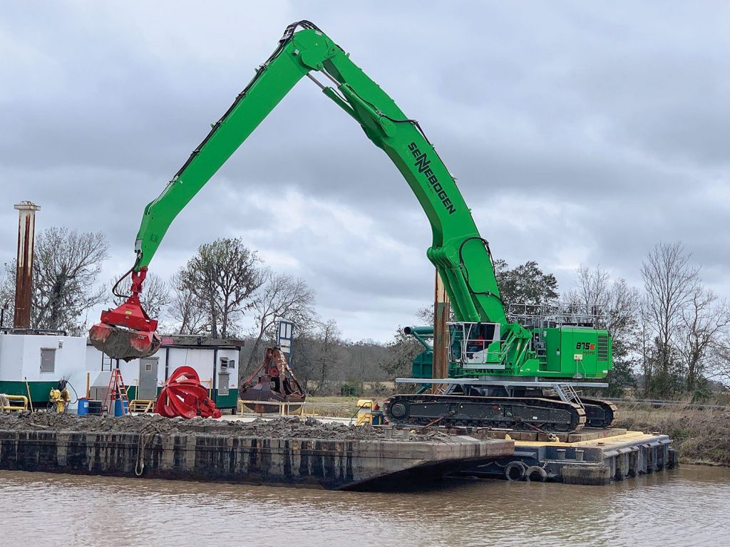 With Sennebogen 875’s quick-change coupler, it’s no problem to have sometimes a grapple, sometimes a rock grapple, sometimes a bucket.  (Photo courtesy of Sennebogen)