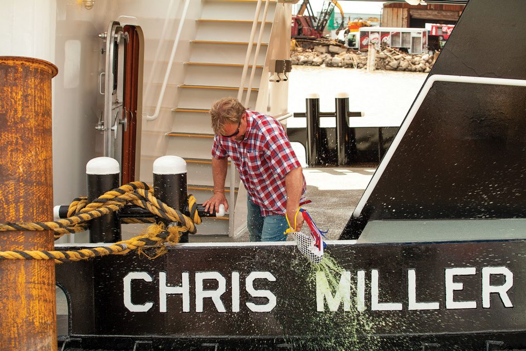 Chris Miller christens his namesake towboat. (photo by Frank McCormack)