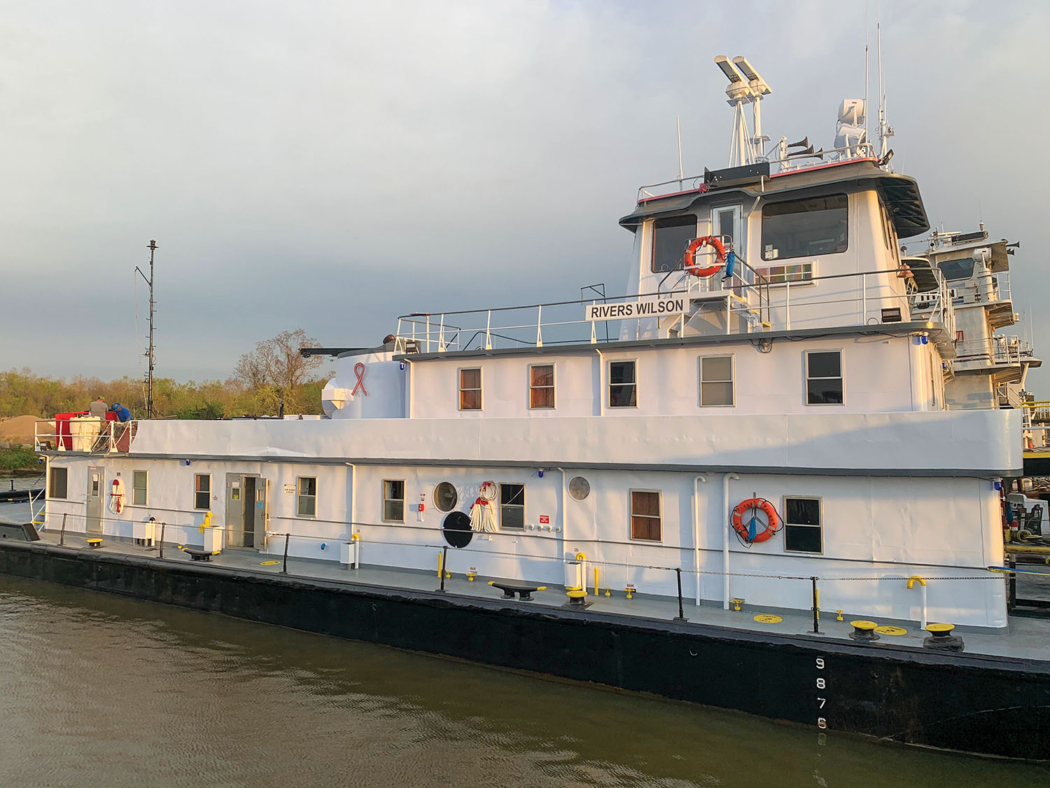 Although it still bears the nameboards of the Rivers Wilson in this picture, the mv. William Glen sports pink ribbons for breast cancer awareness on its stacks.