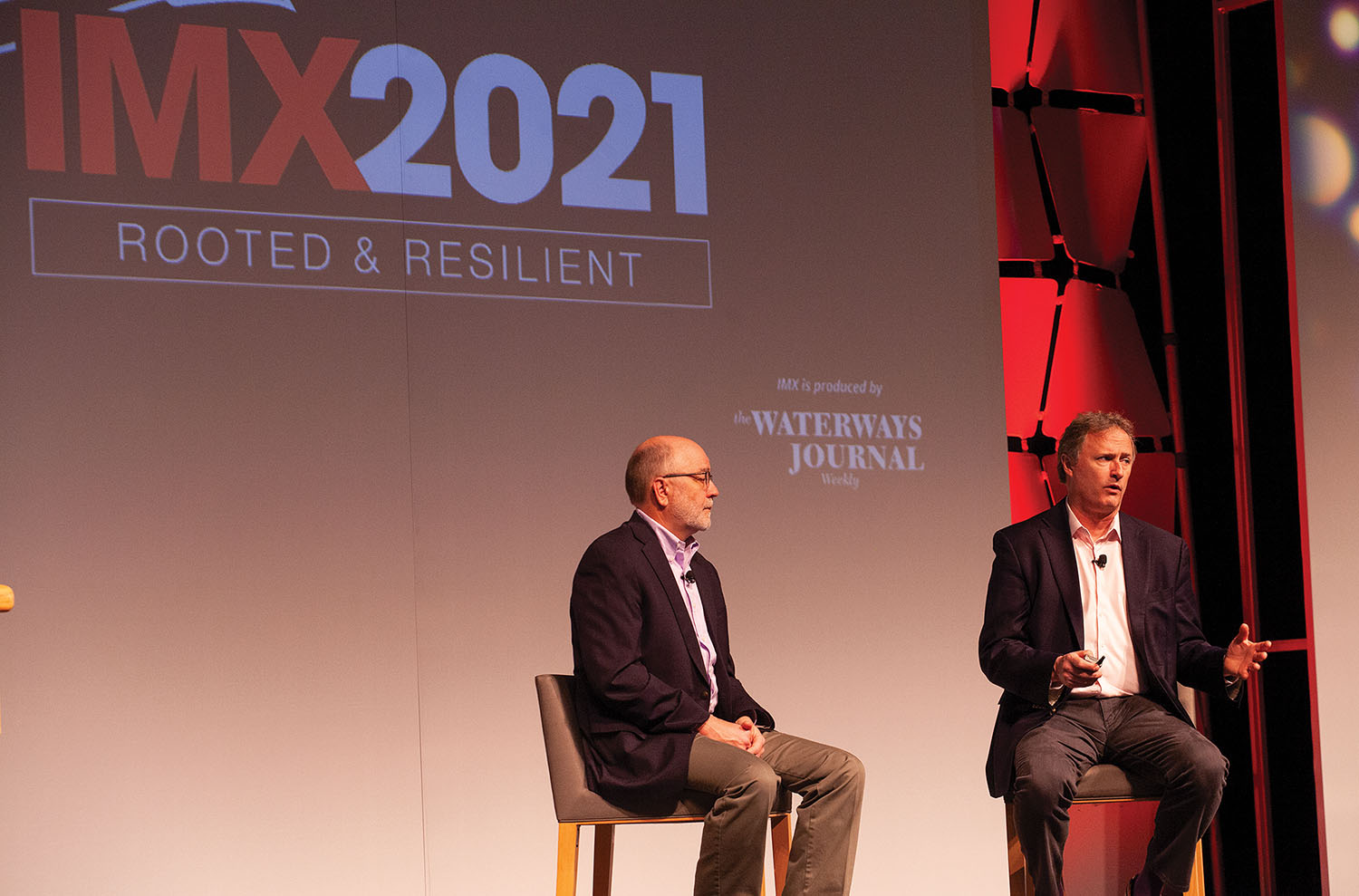 Roger Bernard, left, and Ken Eriksen, both of IHS Markit, discuss the “State of the Industry” during the keynote session of the Inland Marine Expo May 25 in St. Louis. (Photo by Frank McCormack)