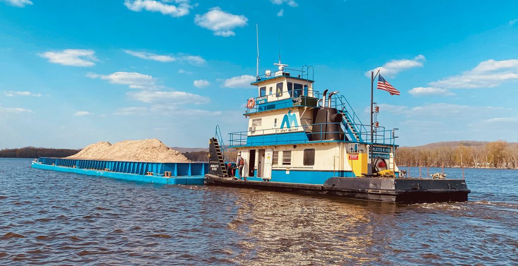 The Scarlette River, another of the repowered boats, works on a Corps of Engineers Habitat Rehabilitation and Enhancement Project (HREP). (Photo courtesy of Newt Marine Service)