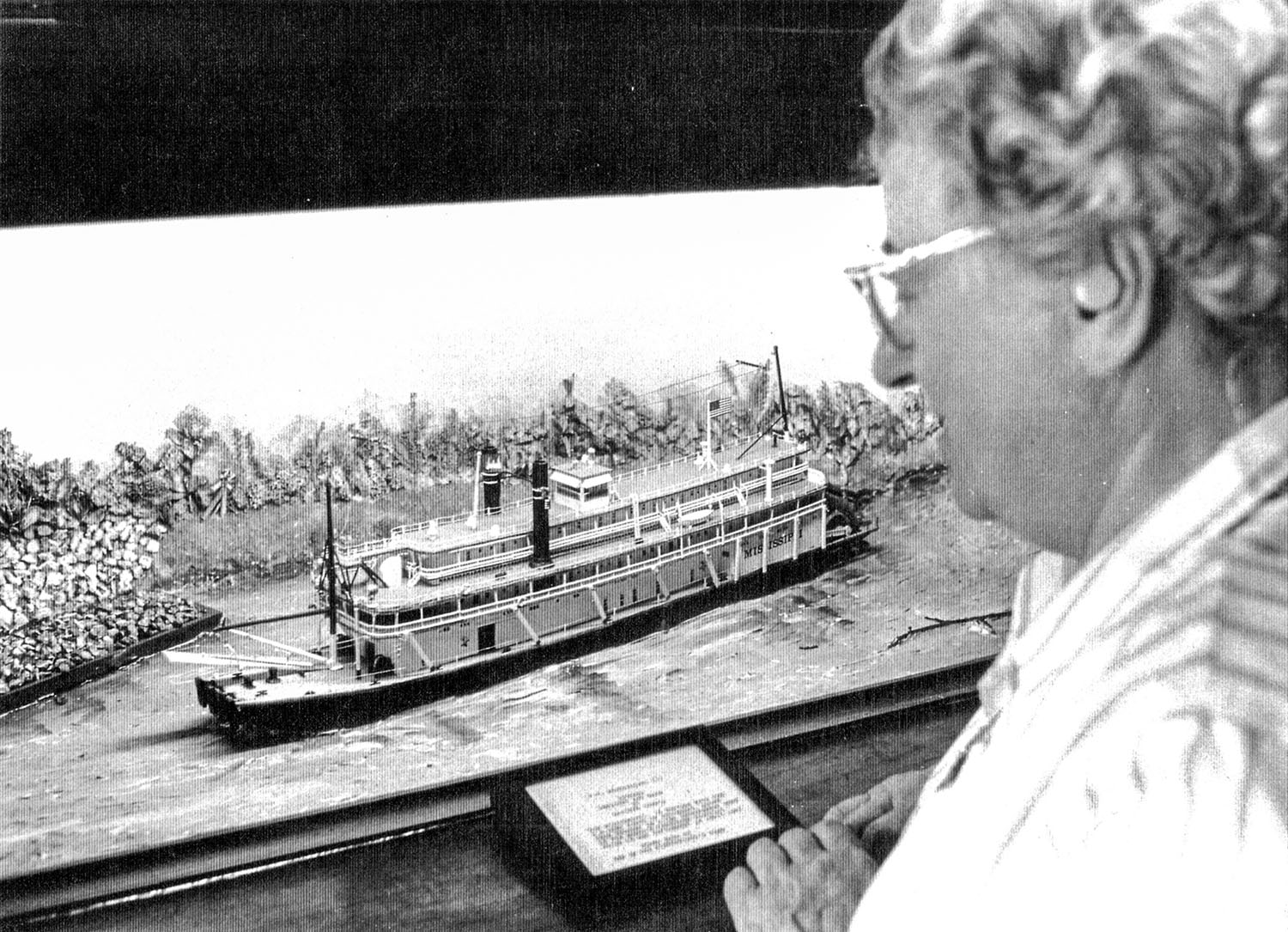 Midship Museum curator Ruth Ferris looks at a model (built by a crew member) of the Str. Mississippi III. (Keith Norrington collection)