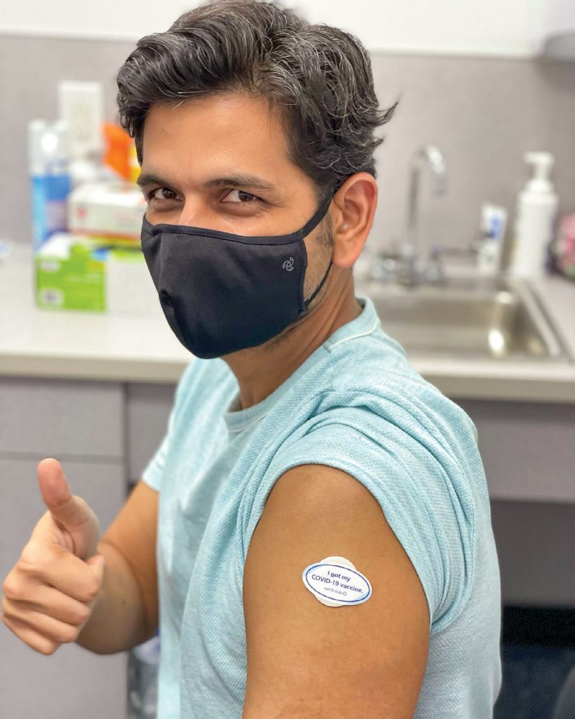A mariner gives a thumbs up after receiving the COVID-19 vaccine as part of Global Maritime Ministry's effort to connect international seafarers with the vaccine.