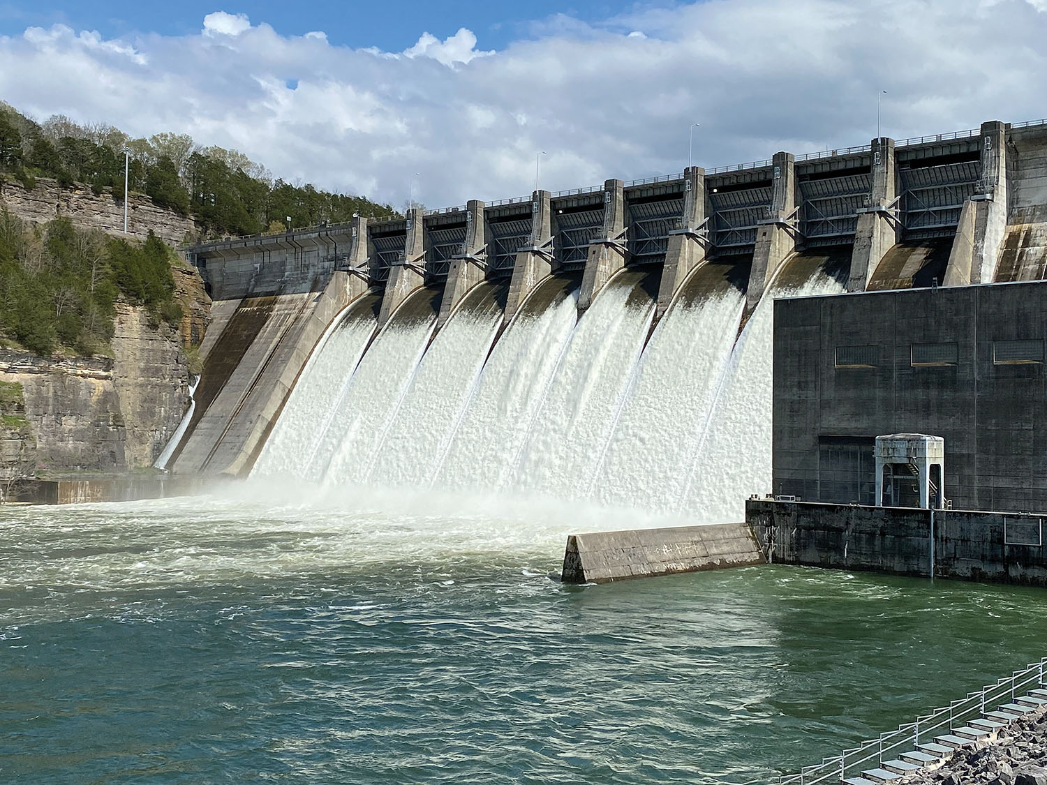 Center Hill Dam on the Caney Fork River in Lancaster, Tenn., discharges water from its spillways April 8, 2021.  (Photo by Lee Roberts, Nashville Engineer District)