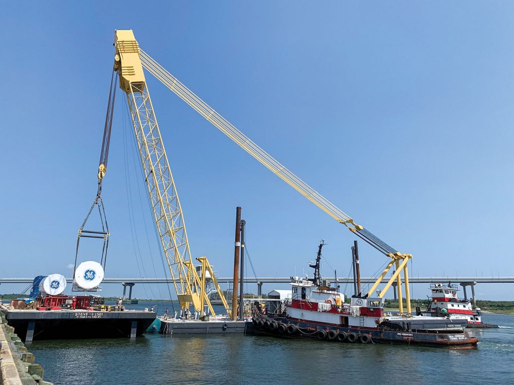 The heavy lift derrick Ocean Ranger loads General Electric turbines in Charleston. They were delivered from Charleston to East China, Mich., via the St. Lawrence Seaway. (Photo courtesy of Stevens Towing)