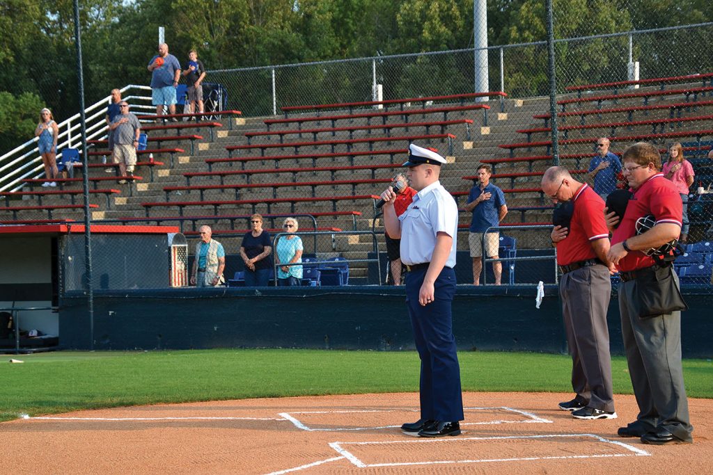 MST3 Trevor Turkin sings the National Anthem. (Photo by Gregory Cannon)