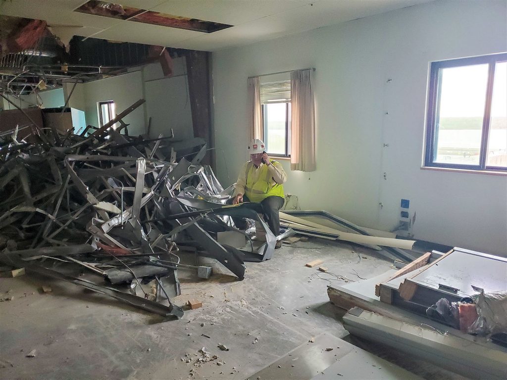 Bill Hunter sits in the Olmsted Resident Office, which is being demolished after more than 30 years of use at the construction site for Olmsted Locks and Dam. (Photo courtesy Louisville Engineer District)