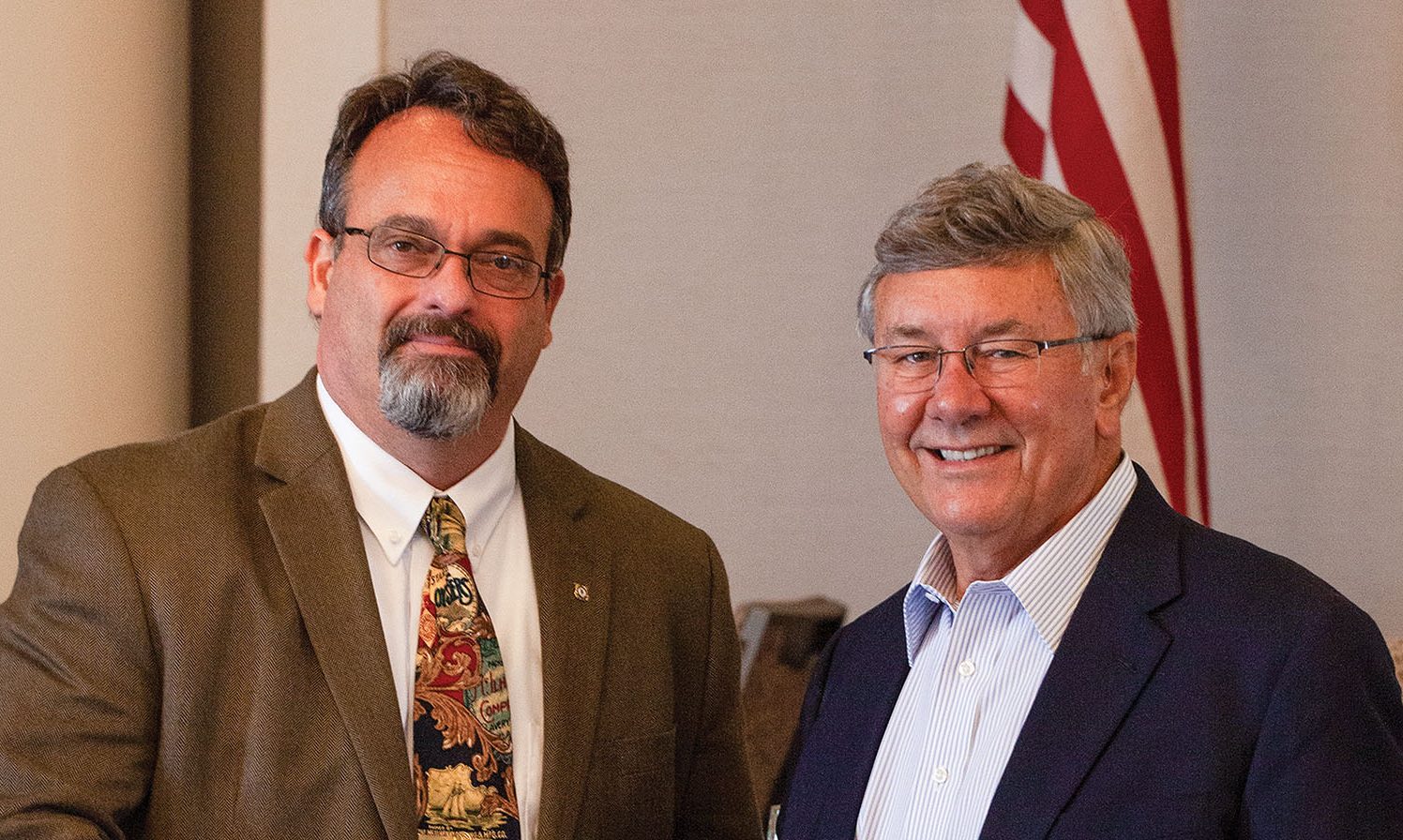 Paul Dittman, left, and Jim Stark, both former Coast Guard captains, are the incoming and outgoing, respectively, presidents of the Gulf Intracoastal Canal Association. (Photo by Frank McCormack)