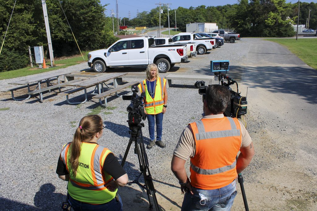 Deb Calhoun, Waterways Council Inc. senior vice president, gives an interview to CBS and NBC affiliate television stations outside the resident office for the Kentucky Lock Addition Project. (photo by Shelley Byrne)