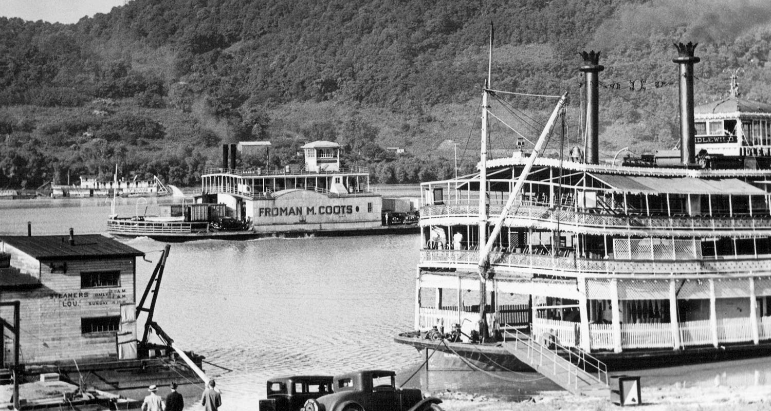 The ferryboat Froman M. Coots passing the moored excursion steamer Idlewild at Madison, Ind. (Keith Norrington collection)